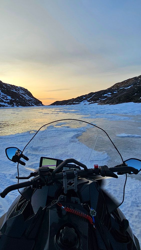 Driving over a frozen lake back to the hotel while the sun is setting
