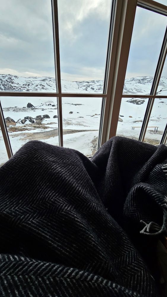 Cuddled up in a backcountry hut in Greenland