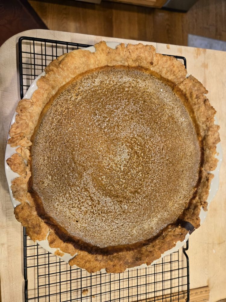 Pumpkin pie on a cooling rack