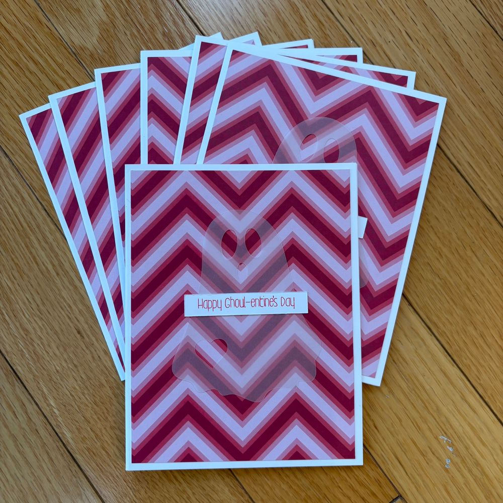 A collection of seven chevron-patterned cards in red and white, each featuring the message "Happy Ghoul-entine's Day and a see-through ghost.