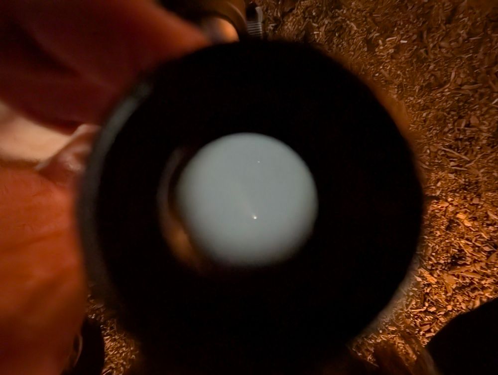Photo of a comet visible through a telescope 