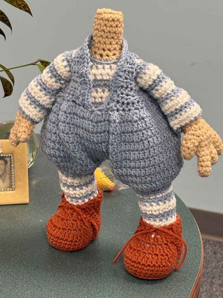 Amigurumi Crochet body in blue overalls. 