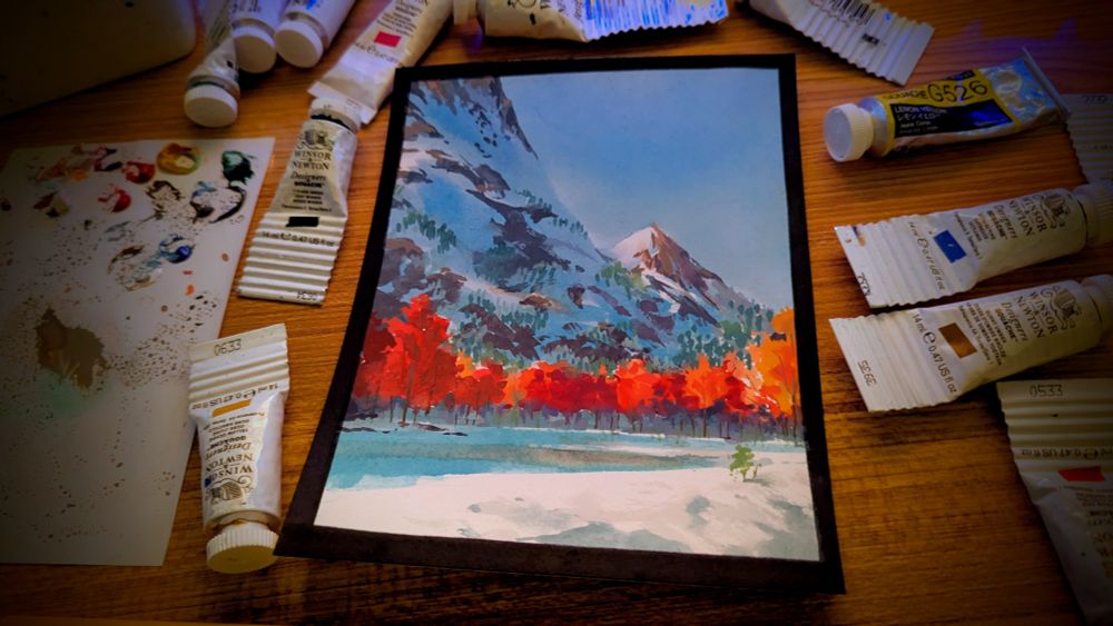 painting of some very tall mountains covered in winter snow

at the base of the mountains, a frozen lake and bright red trees