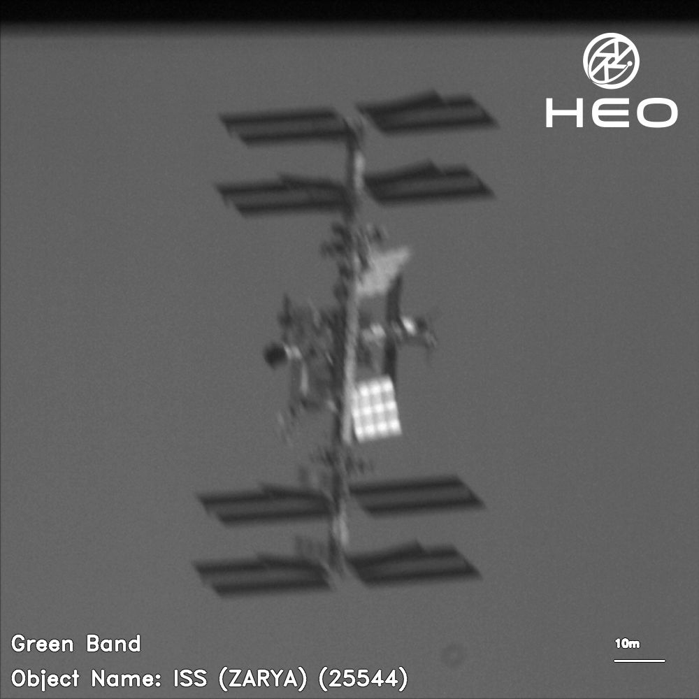 A black and white image of the International Space Station captured via a satellite by heospace.com 2025-06-14 21:28:56 UTC.

The picture has a resolution of 18cm from a distance of 85.77km.