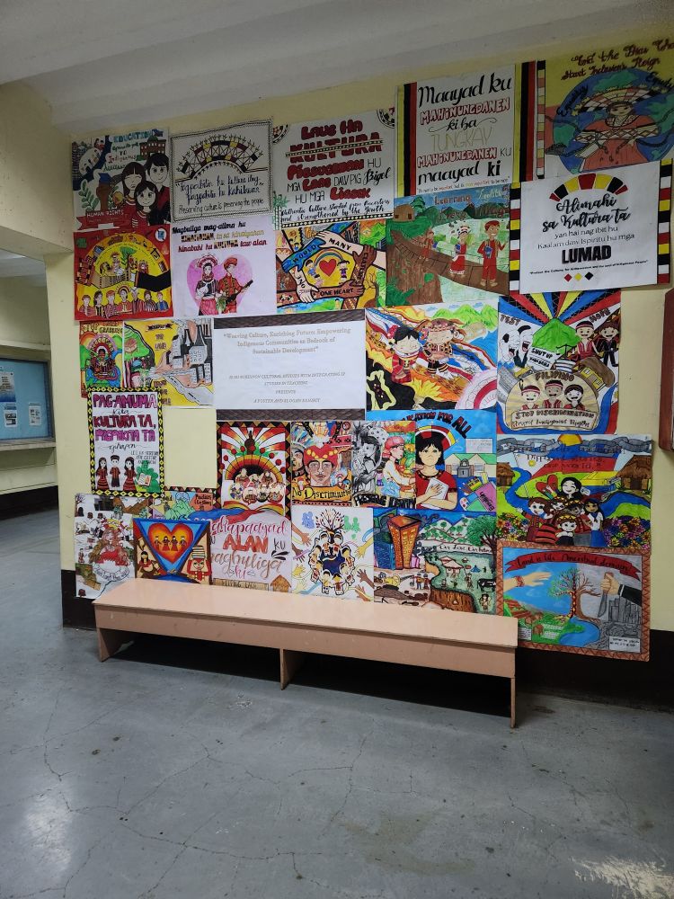 Zoomed out view of the whole wall covered with colourful posters