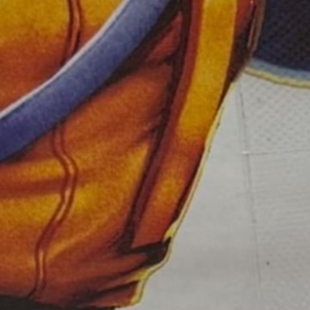 A close-up of the character's left shoulder strap. It ends apruptly somewhere down his vest. 