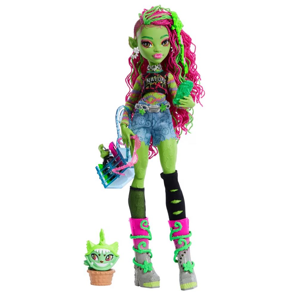 Monster High doll. Green skin, pointy wears, pink braided hair.