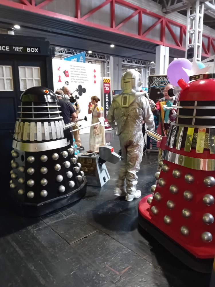 Dalleks and a Cyberman with the Doctor and Tardis.