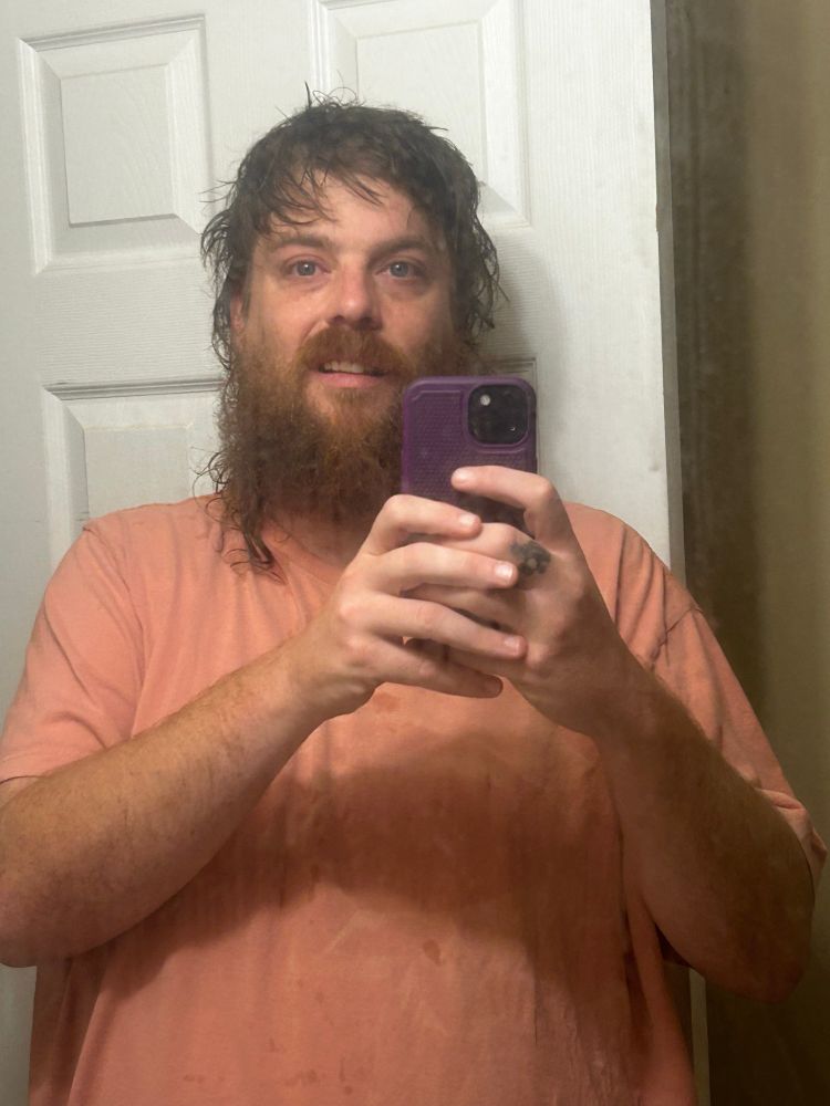 sid freshly showered in a very dirty mirror 