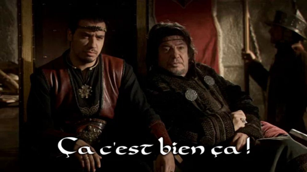 two men sitting next to each other with the words ca c'est bien ca on the bottom