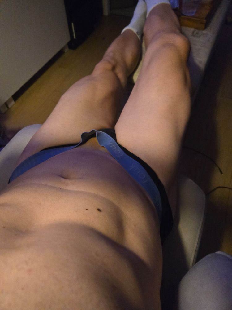 I'm lying down wearingvtight underwear and white socks. Lighting is pretty sexy.