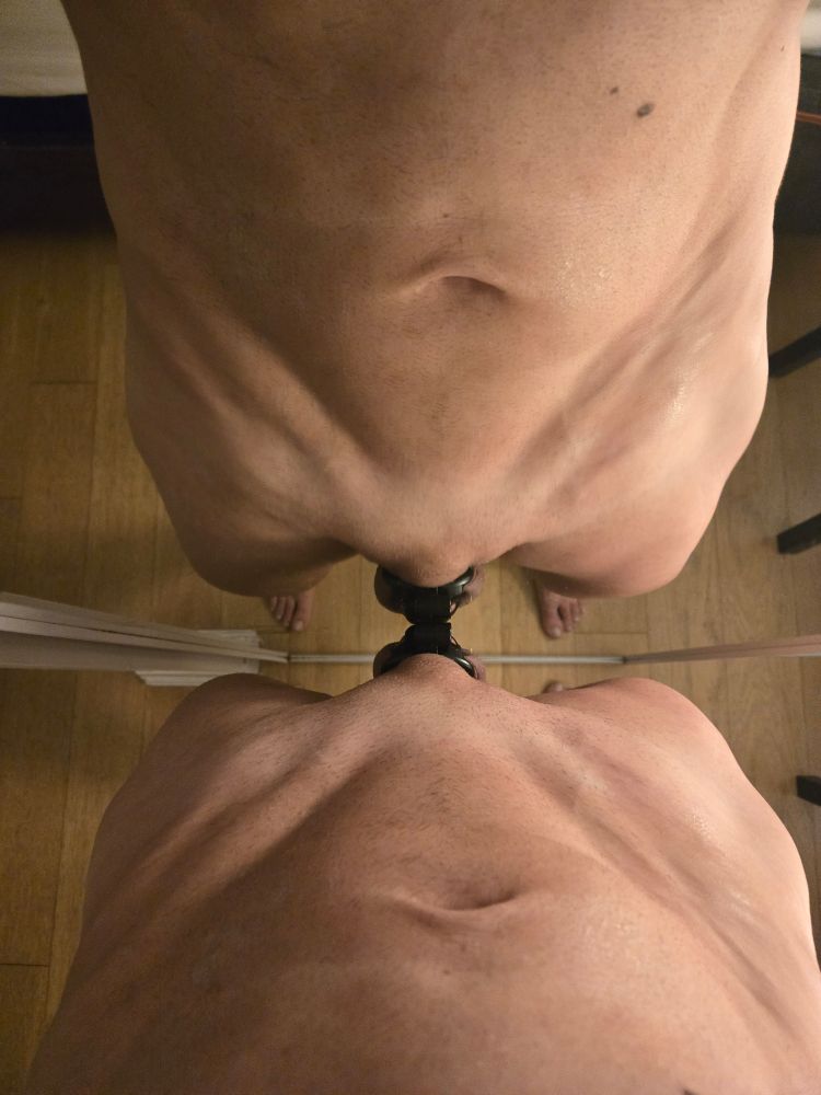 I'm standing in front of the mirror with the reflection of my iliac furrow forming and "x" in the mirror.