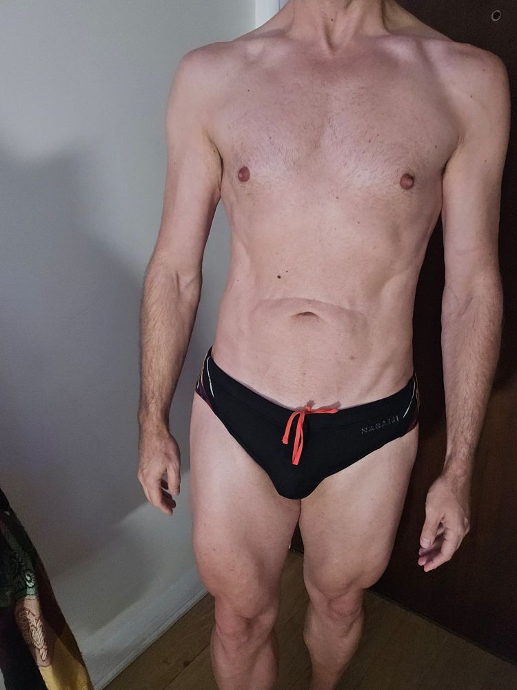 Frontal of me wearingvjust a black speedo. You cant see my cage.