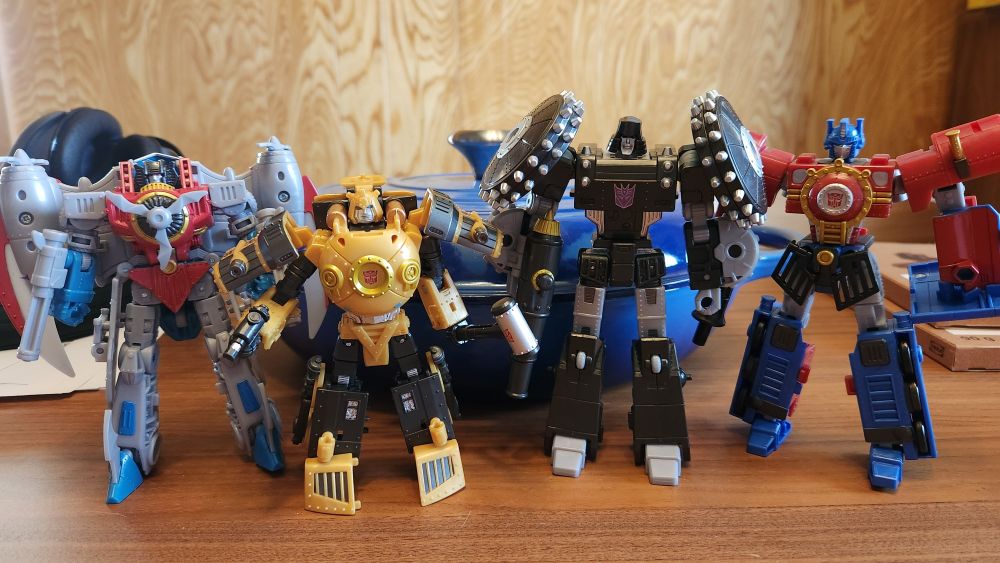 A photo of all the official Hasbro Hearts of Steel toys: Starscream, Bumblebee, Megatron, Optimus. 