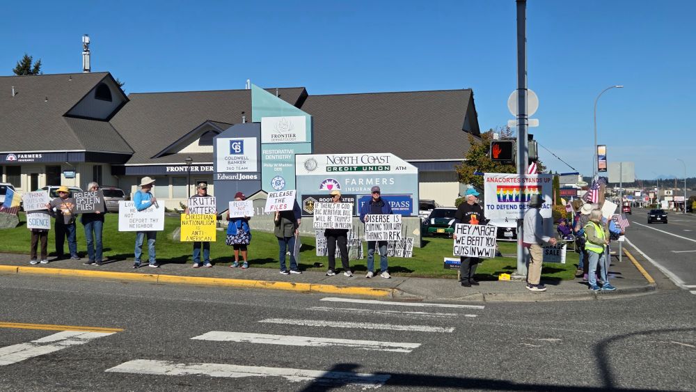 Anacortes Stands Up rally signs on Sundays - one of four corners.