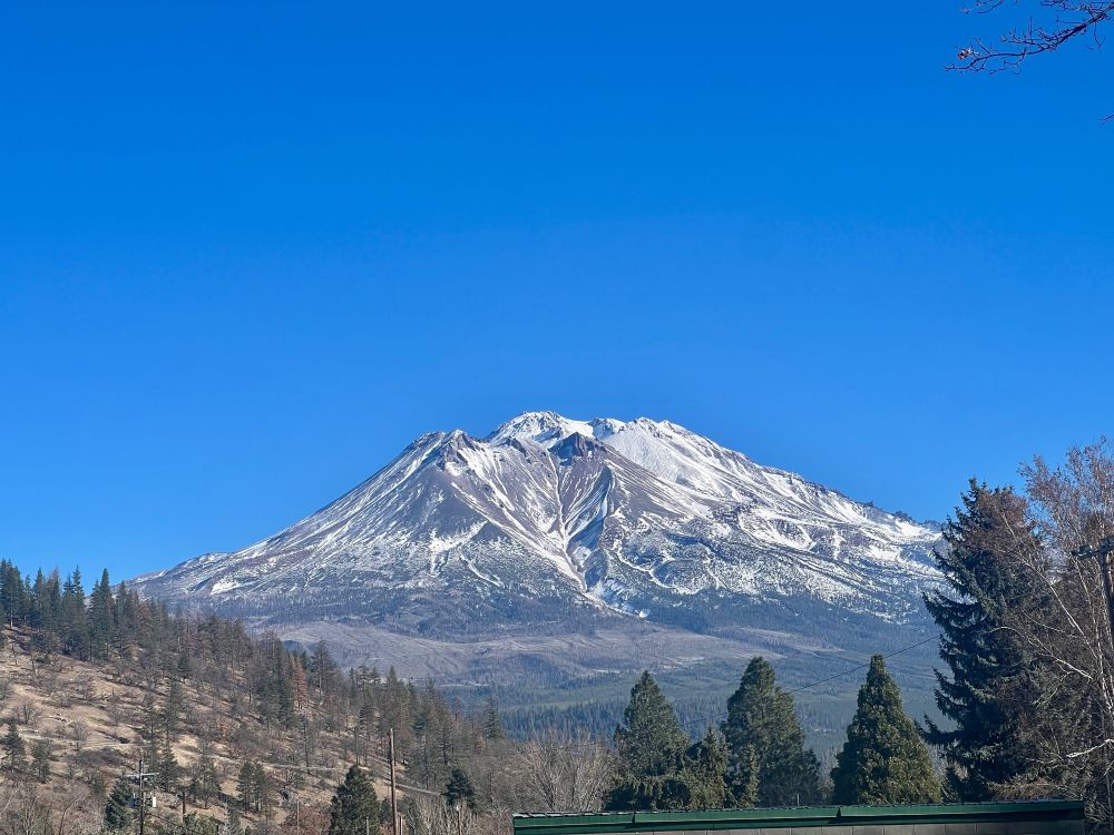The snowy peak of Mount Shasta, seen from the north in Weed, California.