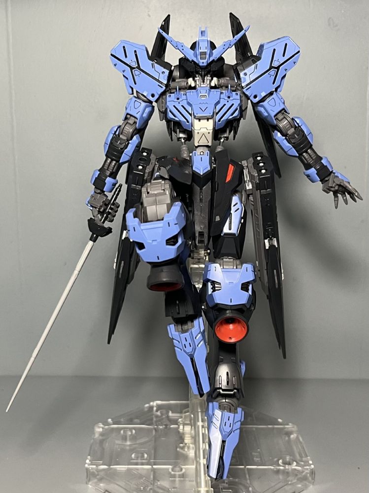 MG gundam vidar in a floating pose with one leg brought up and her sword pointed down and one hand out to the side