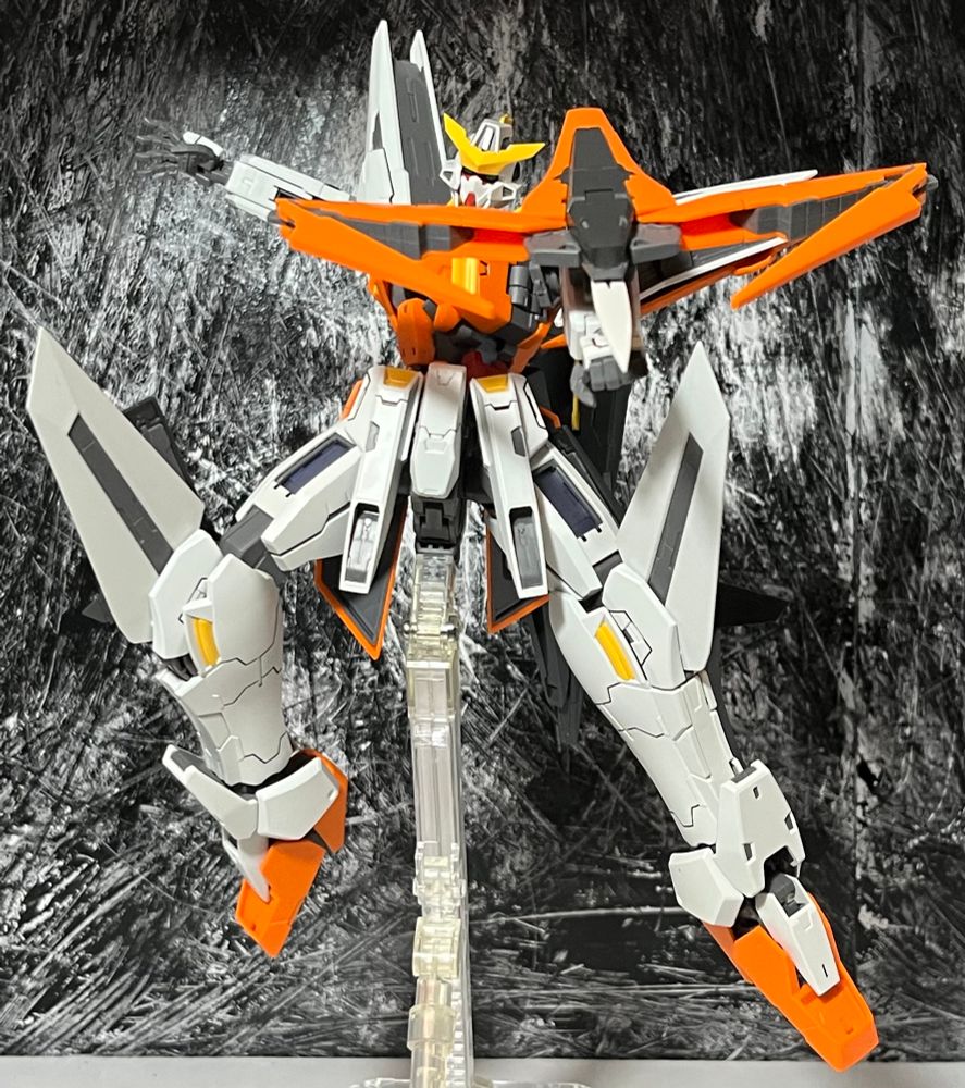 mg kyrios in an aerial pose pointing its shield sword thing at the viewer