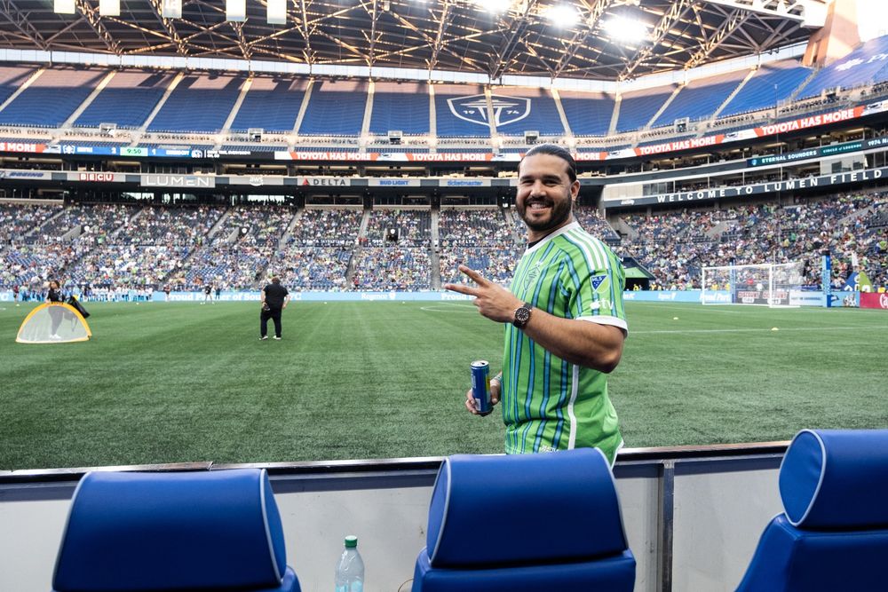 Seattle Mariners third baseman Eugenio Suárez wearing a Seattle Sounders FC 