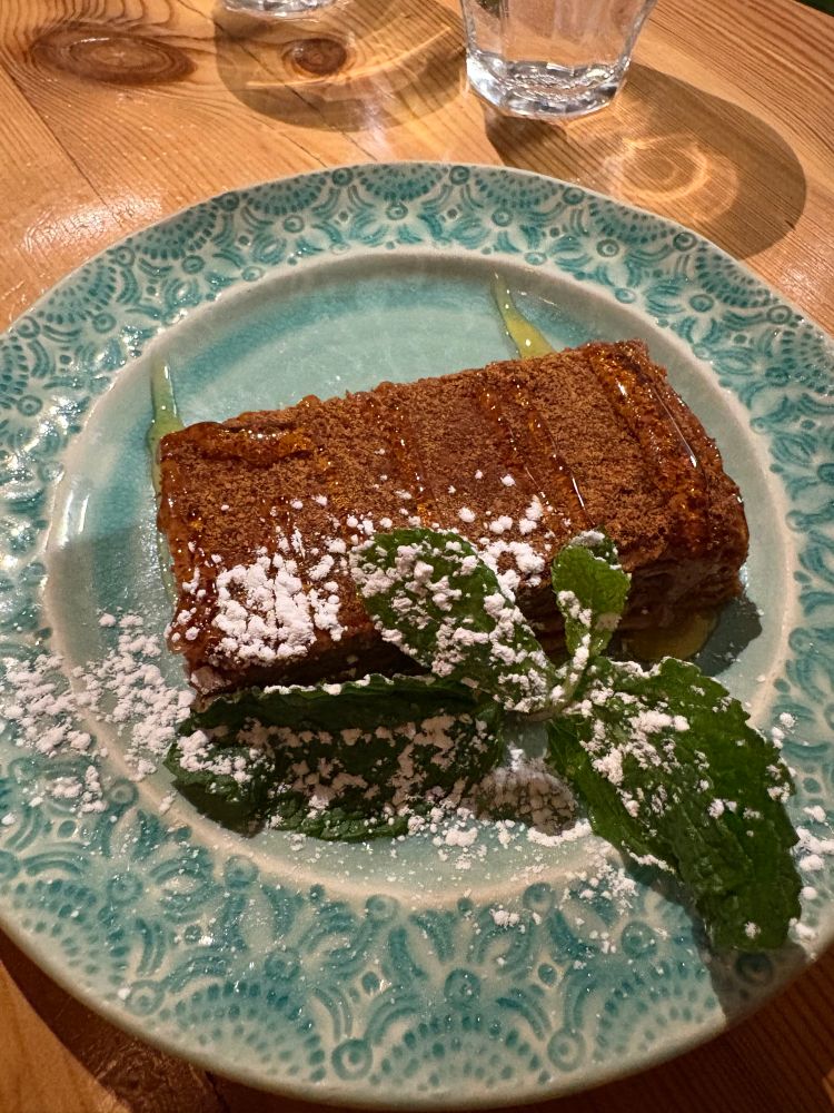 Honey bread with caramel and garnished with a mint leaf