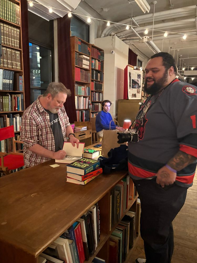 Matt Dinniman signs my son’s book.