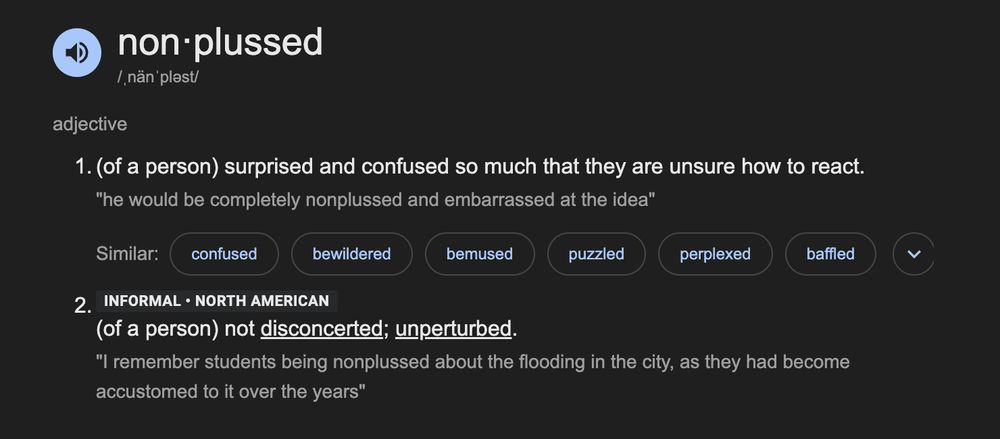 A screenshot of the dictionary definitions of the word "nonplussed", where one definition means "surprised and confused" and the other means "unperturbed" ???