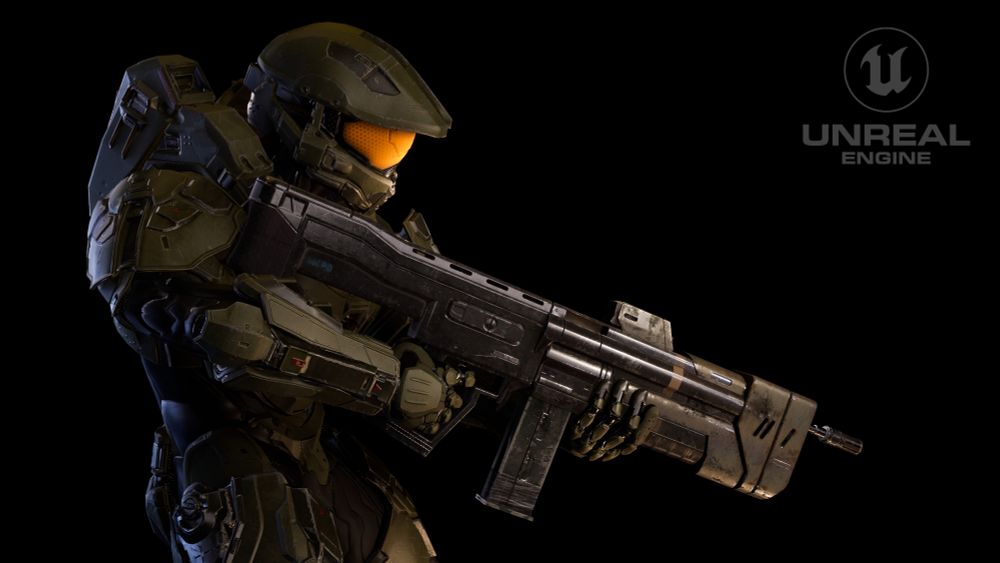 Master Chief holding the weapon that was designed for the Halo Universe 