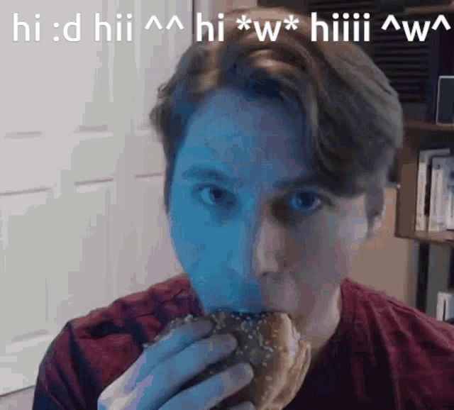 a man in a red shirt is eating a hamburger with a caption that says hi : d hii