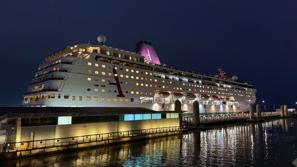 Ambassador Ambition cruise ship docked in Liverpool in the darkness of early morning.