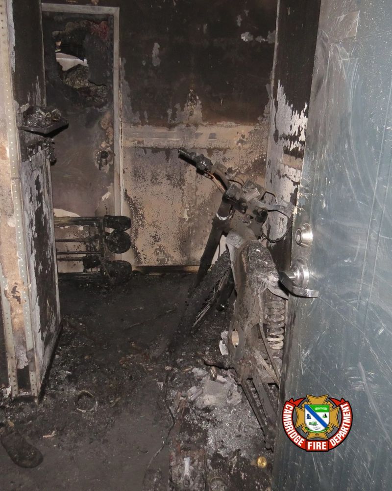 A charred e-bike blocking an exit