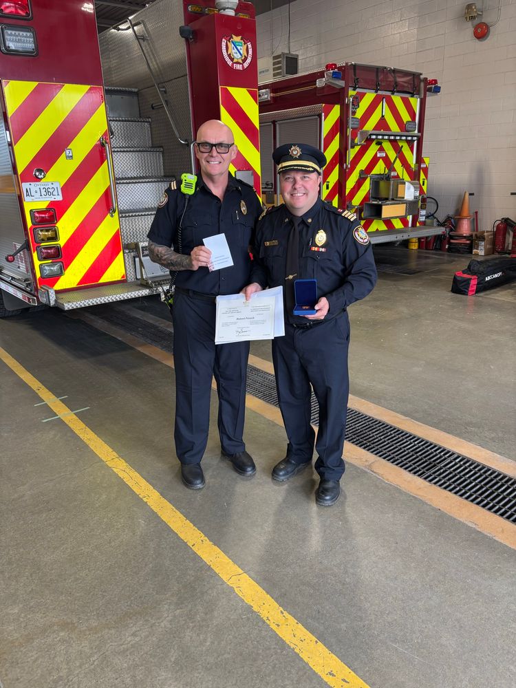 Deputy hands certificate to Captain 