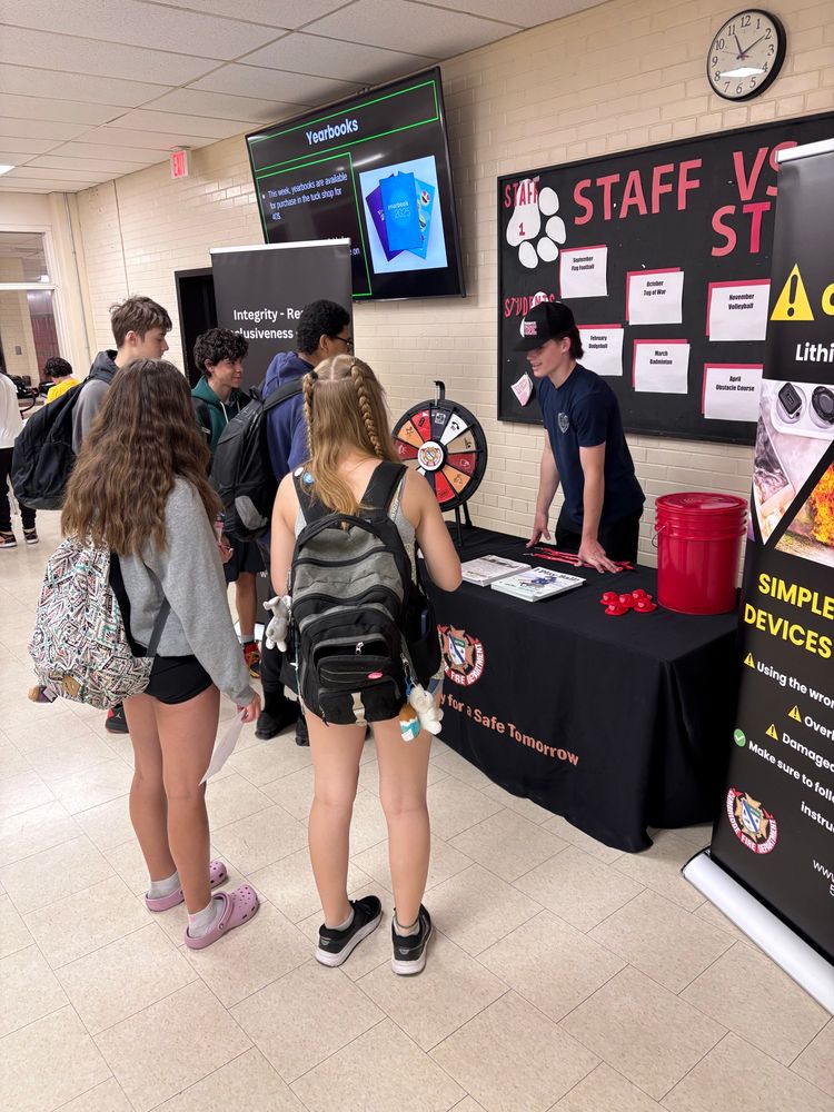 Co-op student teaching high schools students about lithium-ion battery safety 