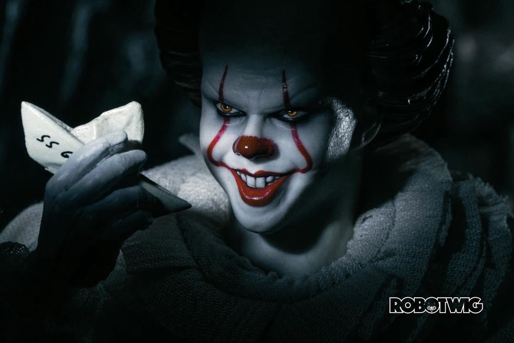 Pennywise in the sewer holds onto George's paper boat
