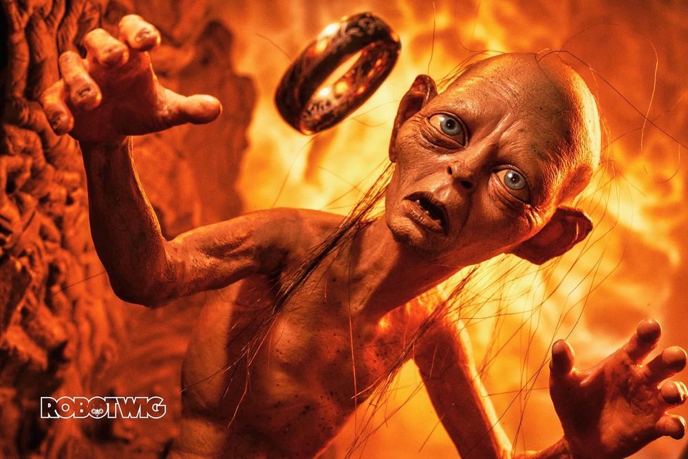 Gollum tries to catch the ring as he falls into mount doom