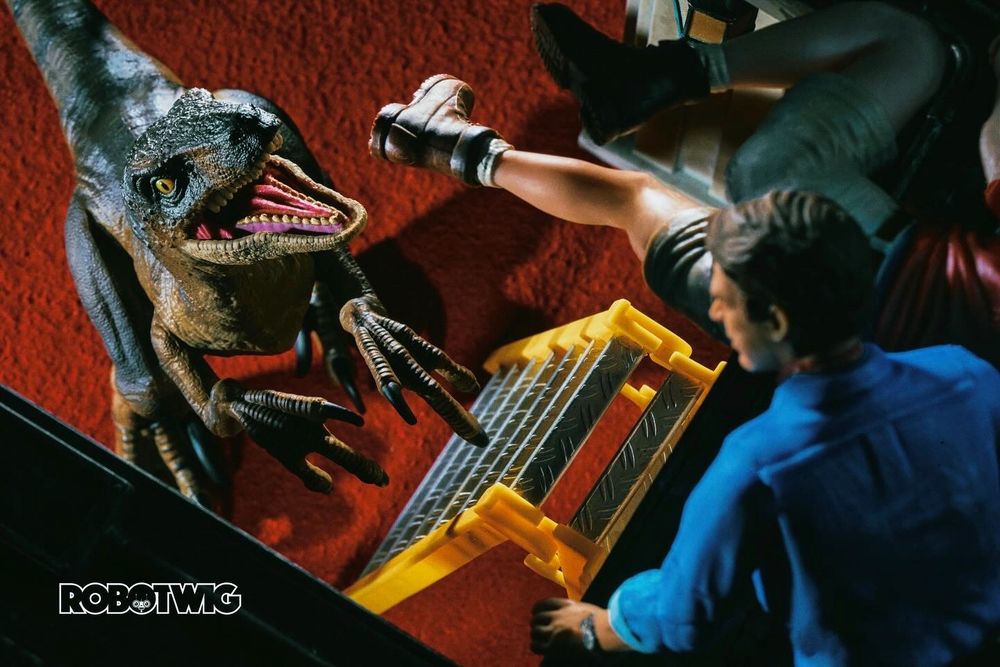 Velociraptor chase Ellie and Grant s they escape into the ceiling using a ladder. Raptor is below looking up at them