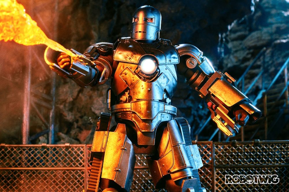 Tony Stark in Mark One suit using his flame thrower. Cave background 
