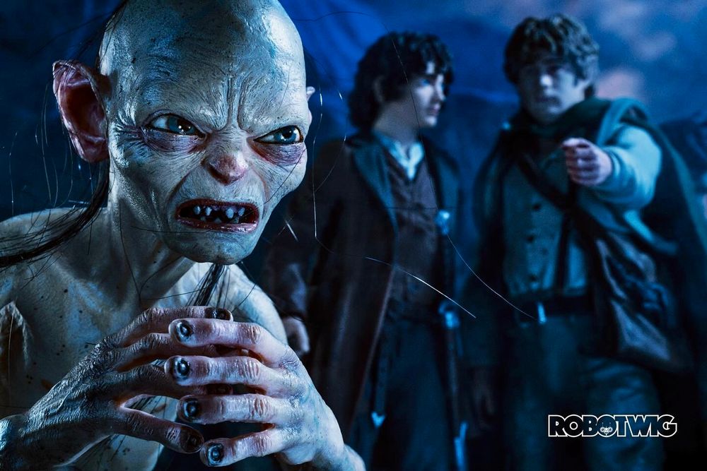 Sam points at Gollum, who's turned away from both of them, Frodo looks at Sam disapprovingly 