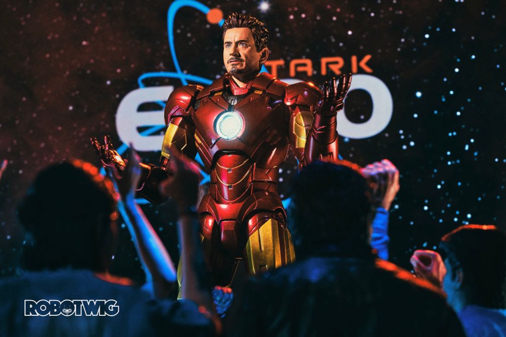Tony Stark on stage in front of a crowd of people