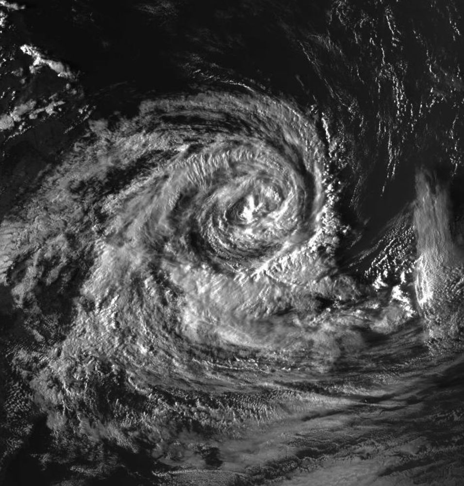 Closeup from previous image showing high-res detail of the cloud spiral of Cyclone Alfred in greyscale. 