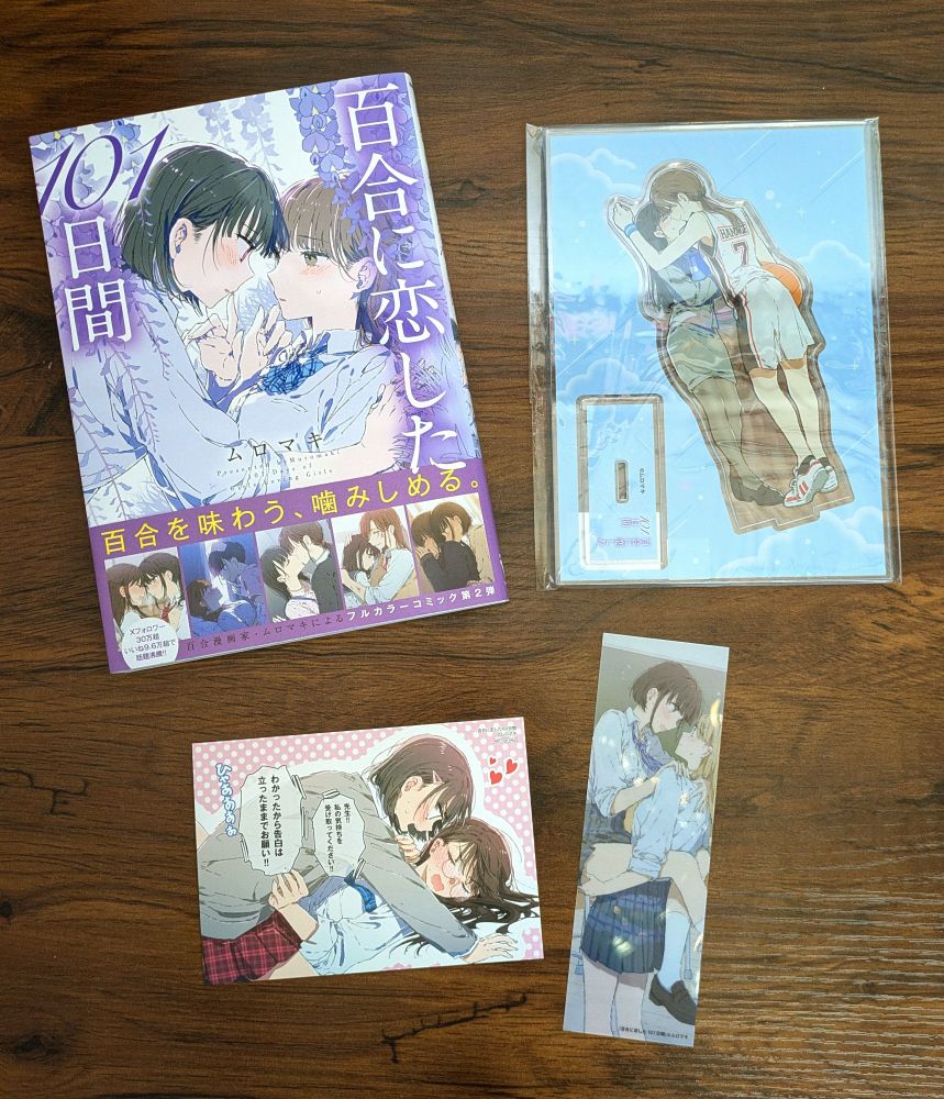 Manga of 101 Yuri Situations, with an illustration card, bookmark, and acrylic stands