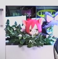 Background of the test stream footage has a variety of minion styled plushies. The focus of the image is a plushie that looks like the Wind-up G'raha Tia minion.