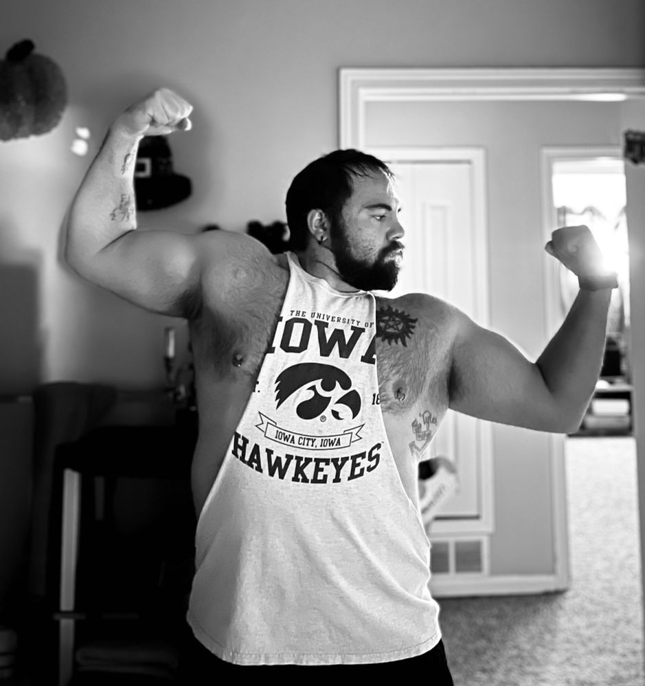 Whip posing in a bathroom mirror. The picture has been filtered in black and white