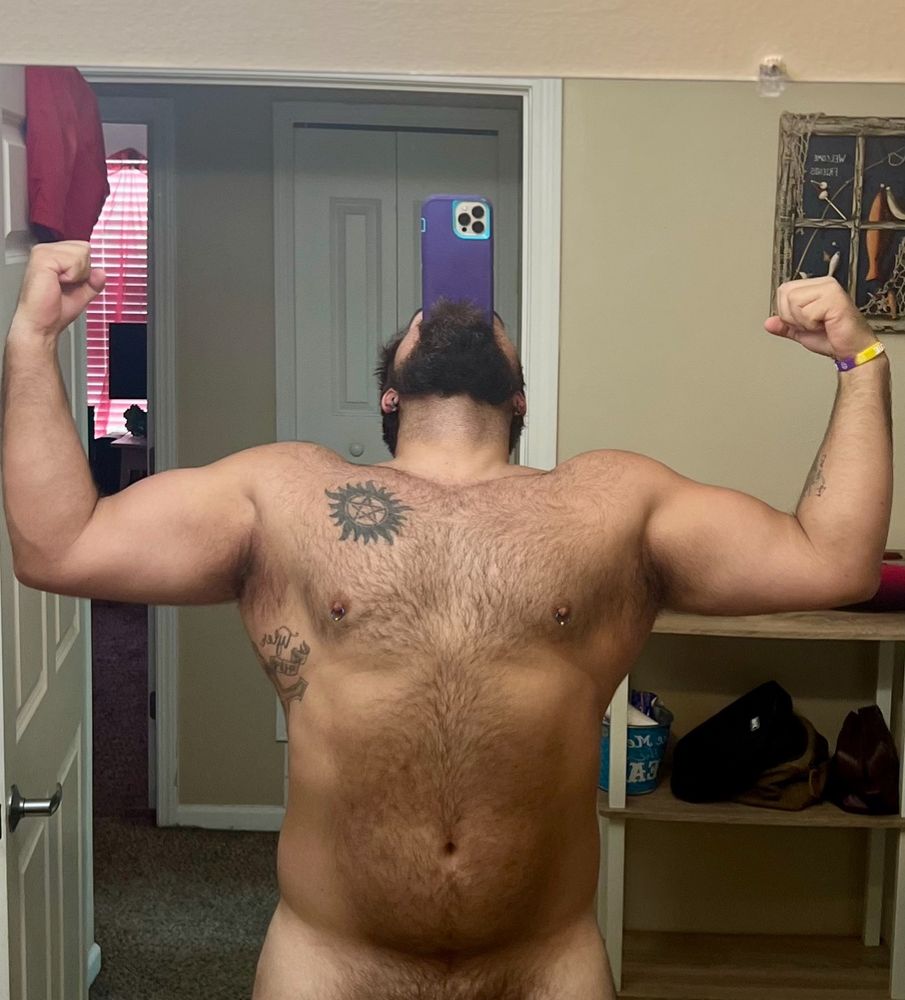 Whip posing in a bathroom mirror looking a little more tan.