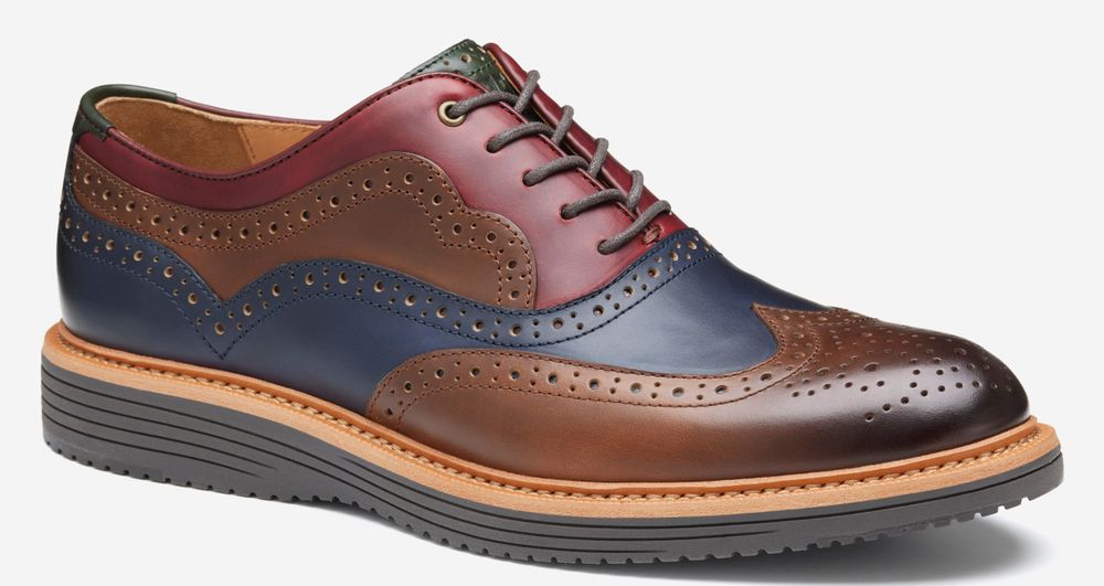 A red, blue, and brown leather looking shoe