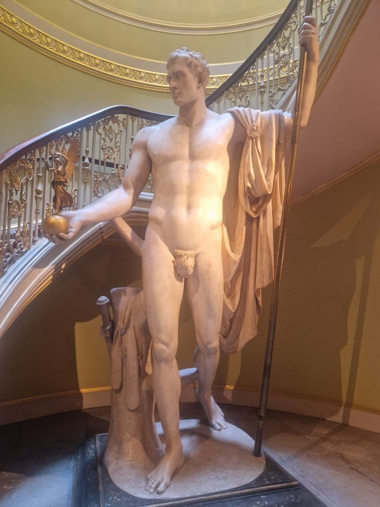 Enormous marble statue of a muscular Napoleon, naked except for a fig leaf