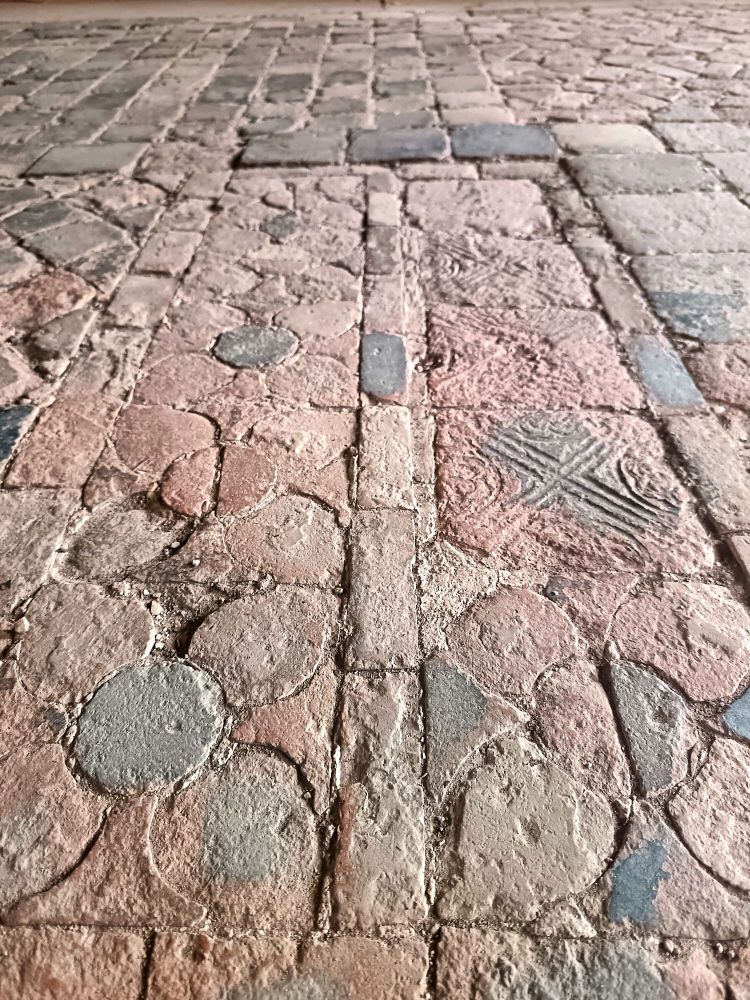 Close up of some decorative and embossed medieval floor tiles
