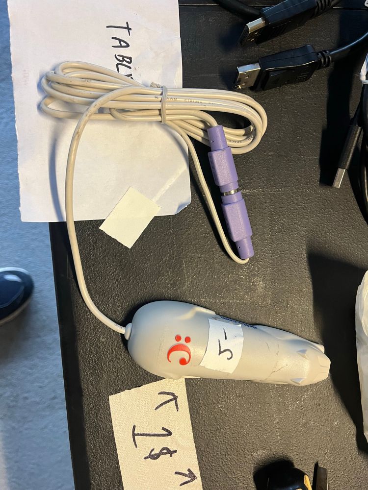 A cue cat, an old barcode reader that was given out for free as part of some sort of dotcom venture