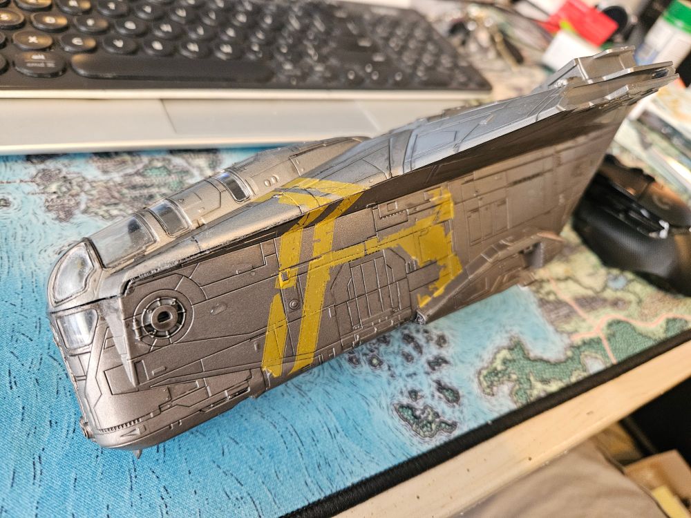 One side of a painted Razor Crest with worn paint decals applied