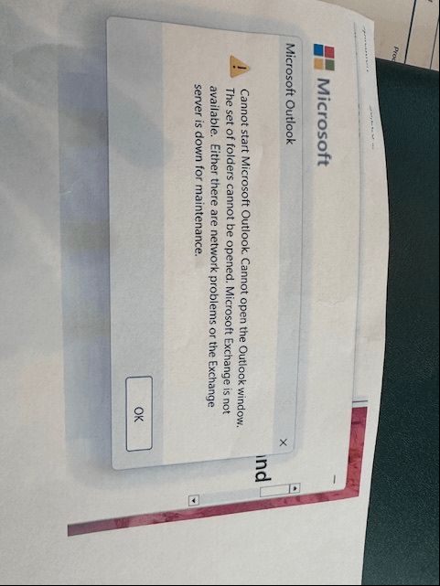 Outlook error message that has been screenshot, printed out in landscape, photographed in portrait and uploaded on Microsoft's help forums