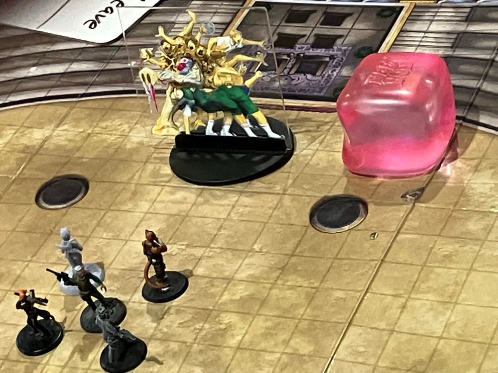 Another battle, on a similar map. This looks to be early, with the characters clustered together in the middle of the map, while near the top are their opponents. One is a squishy pink cube, that looks vaguely like the most threatening sherbert you’ve ever seen. The other is… unpleasant. It’s a horrible yellow amalgamation of limbs and bodies, like you might expect to see in a Souls-like game… except for the cargo shorts on (some of) its legs. (The socks and sandals don’t fit that aesthetic either… but it’s socks and sandals, they don’t fit *any* aesthetic!)